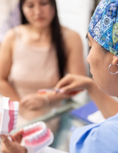 Dentist Providing Oral Hygiene Instructions to a Patient